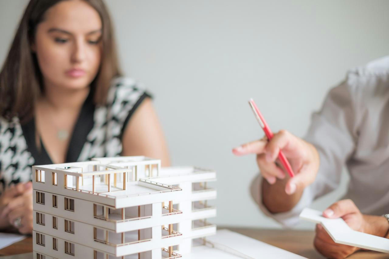 Architects scribbling on paper.