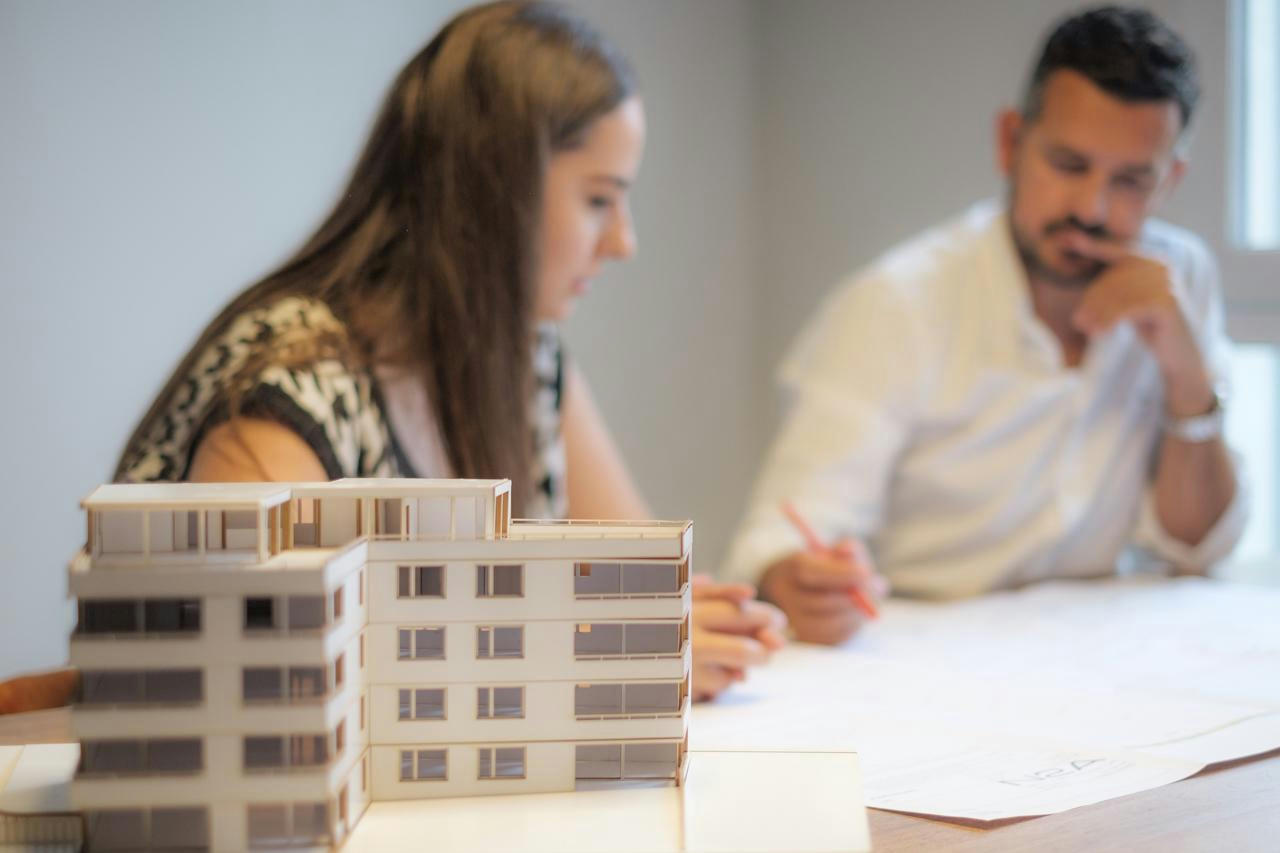 Architects scribbling on paper.